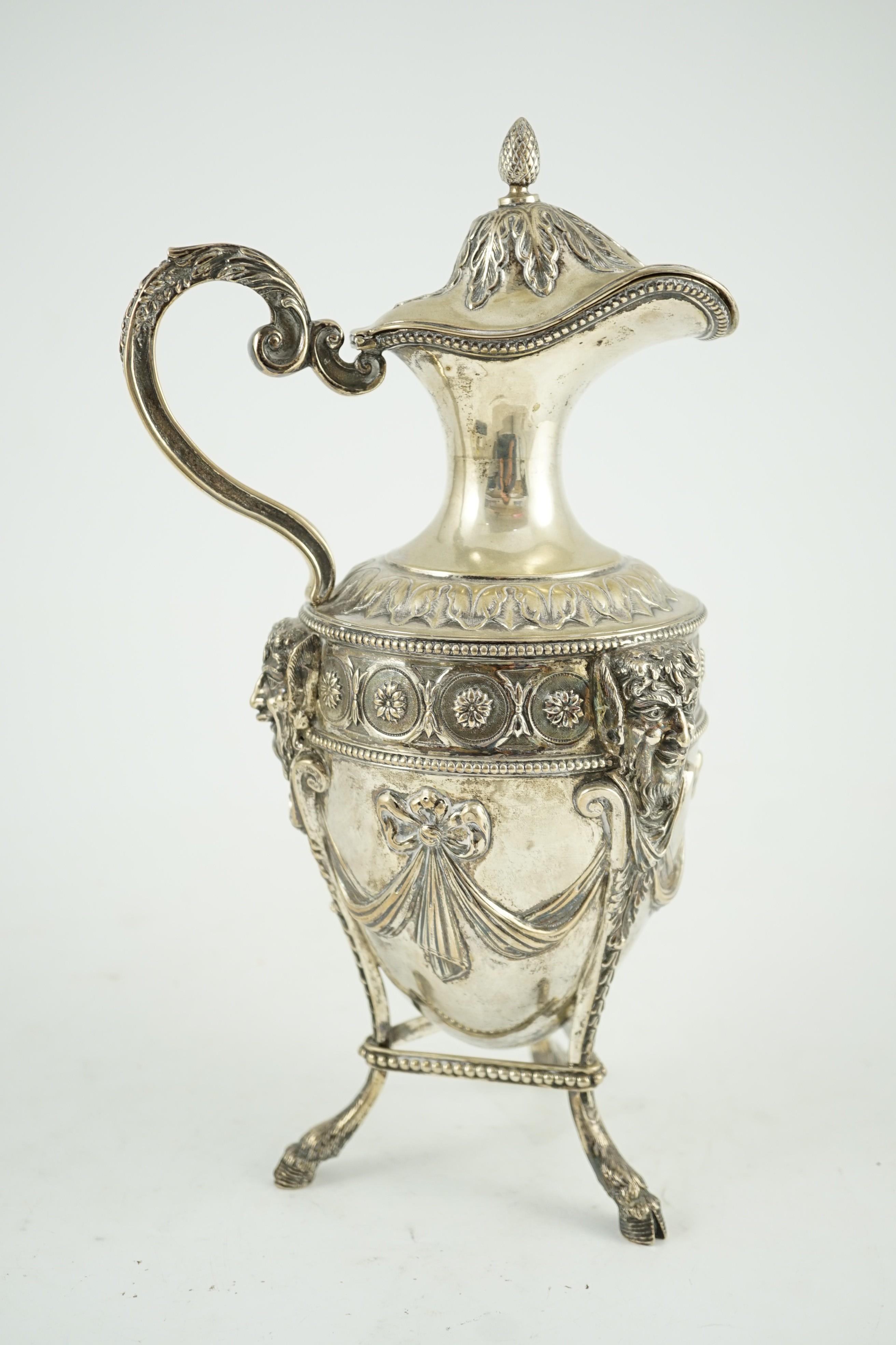 An 18th century French silver vase shaped claret jug